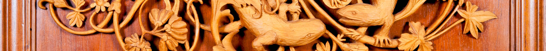 Logo for Bruce Weier Woodcraft - wood carving of lizards